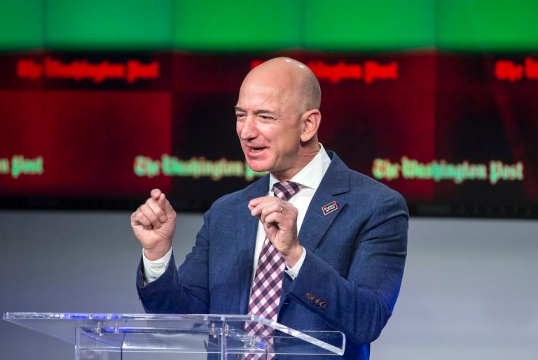 Billionaire Amazon founder and Washington Post owner Jeff Bezos talks about the history and character of the Post during a dedication ceremony for its new headquarters in Washington. The paper made a profit with the help of election readership. 