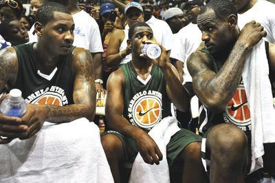 Patrick Smith/Getty Images
Carmelo Anthony, left, Chris Paul, center, and LeBron James played in a charity game in Baltimore on Tuesday.