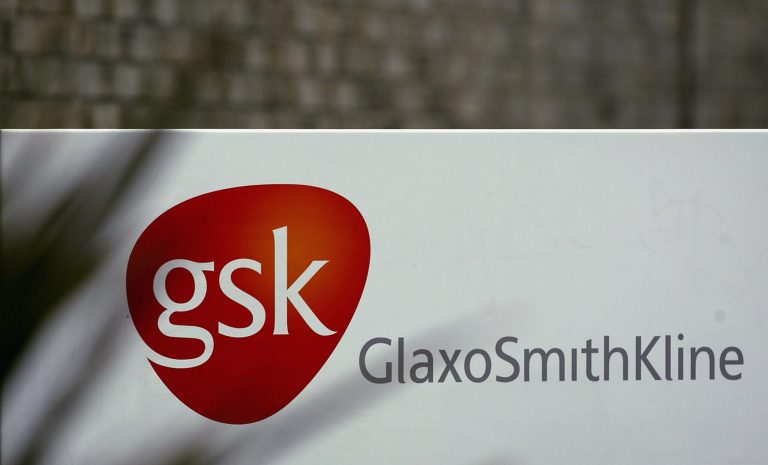 The GlaxoSmithKline logo hangs at the company's office in London. (Photo by Warren Little/Getty Images)