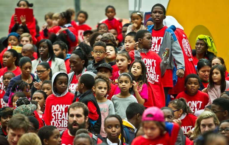 Youngsters listen to speakers during a rally at Foley Square organized by Families for Excellent Schools (FES), Thursday Oct. 2, 201. in New York. Families for Excellent Schools, a grassroots movement of public school families, is calling 