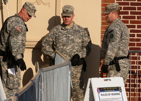 FORT MEADE, MD - DECEMBER 16:  U.S. Army police officers stand guard outside the building where the Article 32 hearing for Pfc. Bradley Manning is taking place December 16, 2011 in Fort Meade, Maryland. Manning is accused of aiding the enemy, wrongfully causing intelligence to be published on the Internet knowing that it is accessible to the enemy, theft of public property or records, transmitting defense information, fraud and related activity in connection with computers.  (Photo by Mark Wilson/Getty Images)