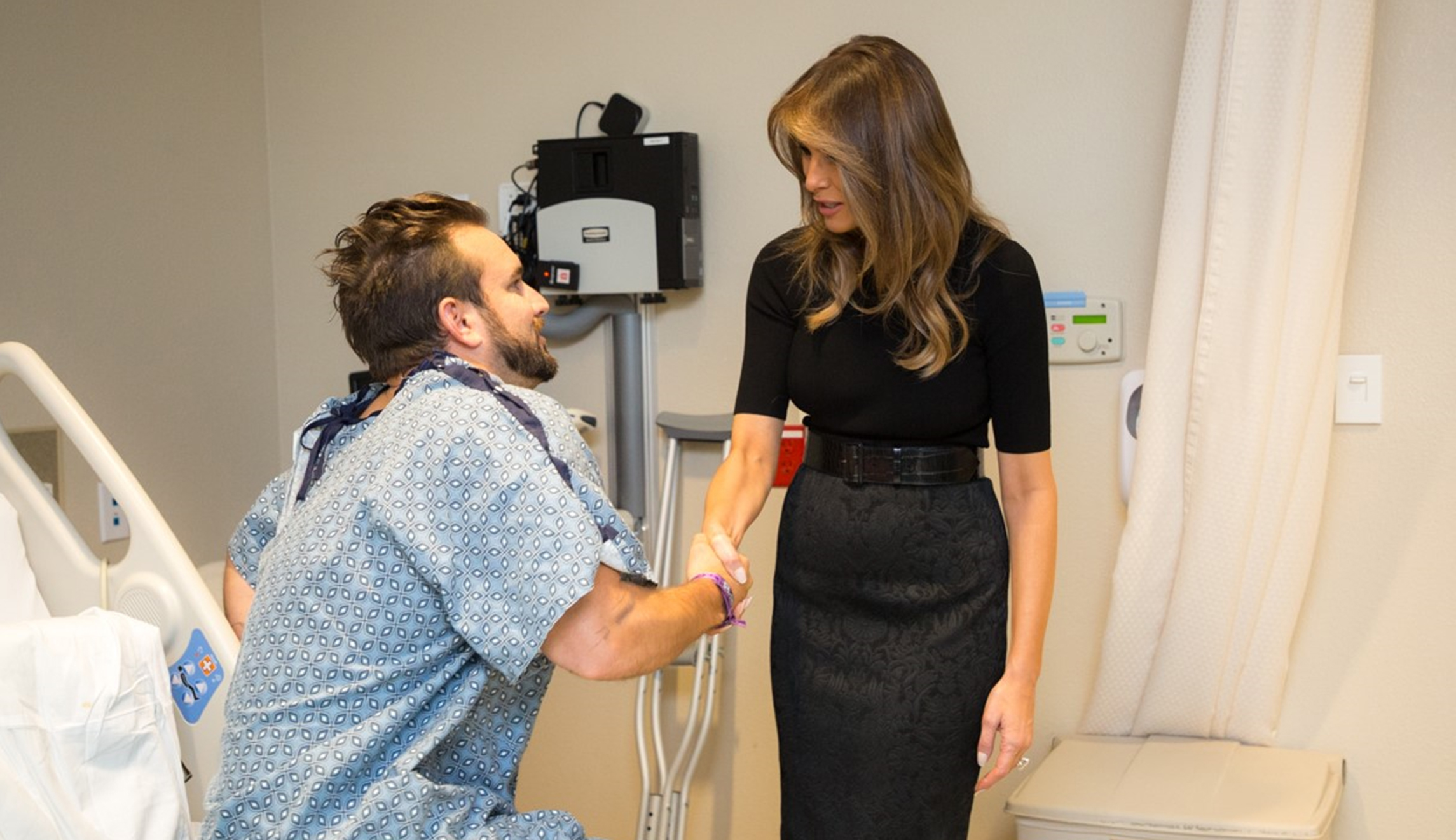 Las Vegas shooting victim who was shot in the leg stands to meet Trump