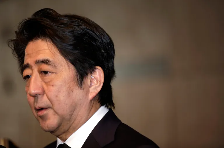 Japanese Prime Minister Shinzo Abe speaks to the media after he signed a book of condolence for the late King Abdullah of Saudi Arabia at Saudi Arabian Embassy in Tokyo Sunday, Jan. 25, 2015. (AP Photo/Eugene Hoshiko)