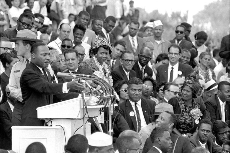   FILE - The Rev. Dr. Martin Luther King Jr., head of the Southern Christian Leadership Conference, speaks to thousands during his 