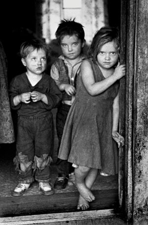 Children of a disabled coal miner stand in the doorway of their Appalachian home in the early 1960s. (Photo by Jack Corn, now belonging to Vanderbilt University.)