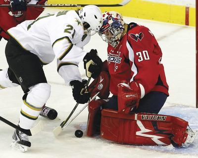 Ann Heisenfelt/AP
Capitals goalie Michal Neuvirth allowed three goals early in the third period to break open a 2-2 tie against the Stars.