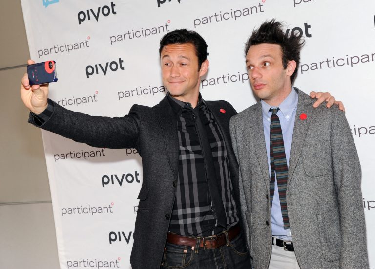 Actor, owner & founder of hitRECord, Joseph Gordon-Levitt, left, takes a photo with production partner Jared Geller at Participant Media's Pivot cable network launch event at the Museum of Arts & Design on Wednesday March 27, 2013 in New York. (Photo by Evan Agostini/Invision/AP)