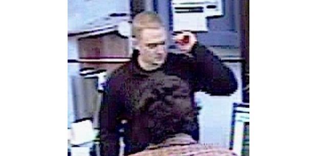 Police seek bank robber who threatened chemical weapon attack