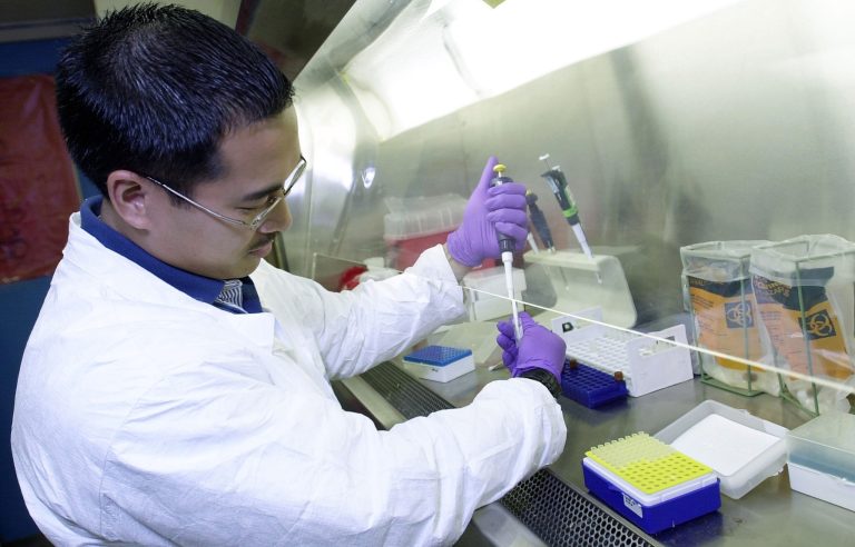 U.S. Navy Petty Officer 1st Class Steve Baluyot of the Biological Defense Research Directorate Naval Medical Research Center in Bethesda, Md., loads unknown samples into capillary tubes for a Rugidized Advance Pathogen Identification Device analysis October 25, 2001 at the New York Department of Health, Public Health Laboratories, in New York, N.Y. (U.S. Air Force Photo by Jim Varhegyi/Getty Images)