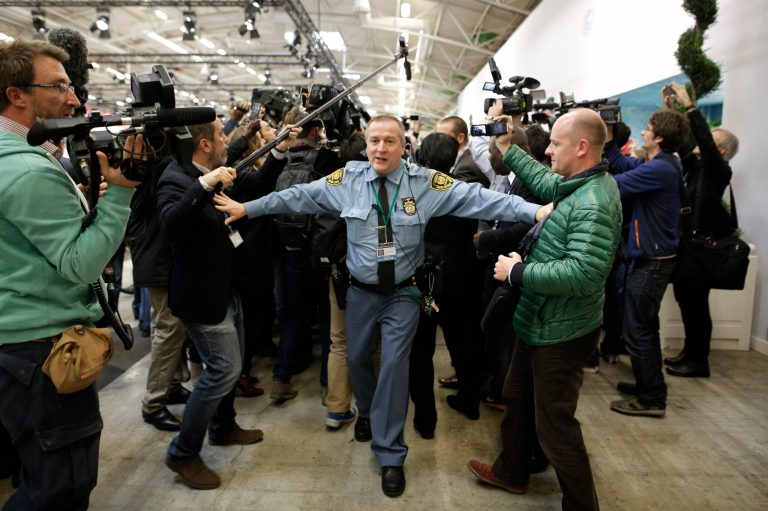 The event in Paris was crowded, and it likely featured overflow seating for both media and non-media attendees. (AP Photo/Laurent Cipriani)