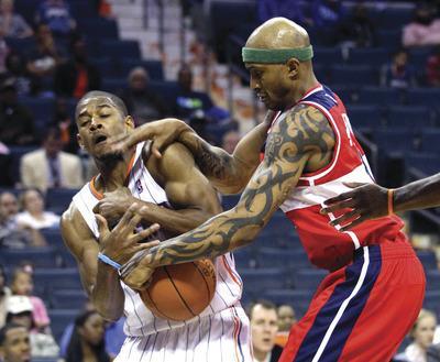 Chuck Burton/AP
In four games for the Wizards this season, forward James Singleton has played solid defense and averaged 10.5 points.