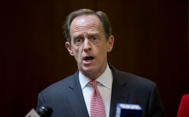 Instead of trying to tie Democratic challenger Katie McGinty to the marketplace troubles, Sen. Pat Toomey has spent most of his campaign trying to make her look weak on national security issues. (AP Photo/Matt Rourke)