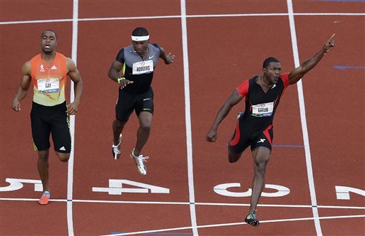 Justin Gatlin celebrates his win in the men's 100m finals at the U.S. Olympic Track and Field Trials Sunday, June 24, 2012, in Eugene, Ore. (AP Photo/Charlie Riedel)