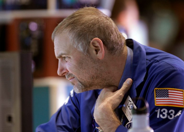   Barclays Specialist Geoffrey Friedman looks at his computer screen at the New York Stock Exchange in New York, Wednesday, Dec. 26, 2012. (AP Photo/Kathy Willens)  