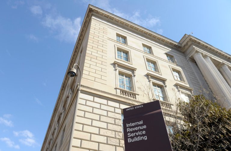 FILE - This March 22, 2013, file photo, shows exterior of the Internal Revenue Service building in Washington. As the United States attempts to punish Russia for its actions in Ukraine, the Treasury Department is deploying an economic weapon that could prove to be more costly than sanctions: the Internal Revenue Service. This summer, the U.S. plans to start using a new anti-tax evasion law that will make it much more expensive for Russian banks to do business in America. (AP Photo/Susan Walsh, File)