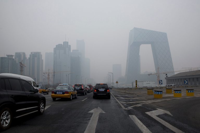 Cars clog in the traffic in Beijing's Central Business District on a hazy day, Friday, Feb. 21, 2014. A rare air pollution alert issued Friday in Beijing prompted health advisories and bans on barbeques, fireworks and demolition work, but fell short of the strictest measures which would include ordering half the cityâs cars off the streets. (AP Photo/Alexander F. Yuan)