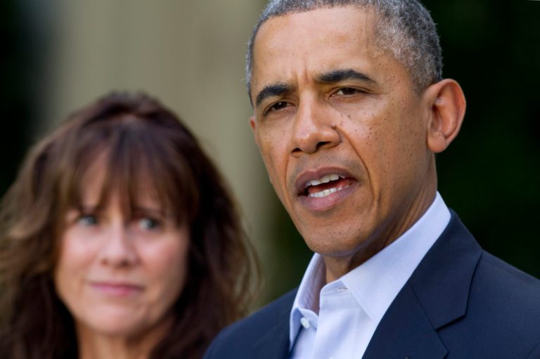 Jani Bergdahl, mother of U.S. Army Sgt. Bowe Bergdahl, listens as President Obama speaks about the release of her son, during a news conference in the Rose Garden of the White House in Washington on Saturday, May 31, 2014. (AP Photo/Jacquelyn Martin)