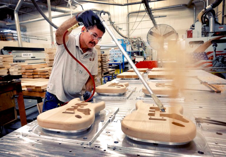 FILE - In this Oct. 14, 2013, file photo, Fender Stratocaster bodies are cleaned out after being cut down by Manuel Espinoza at the Fender factory in Corona, Calif. The Commerce Department reports on U.S. factory orders in April on Tuesday, June 3, 2014. (AP Photo/Matt York, File)