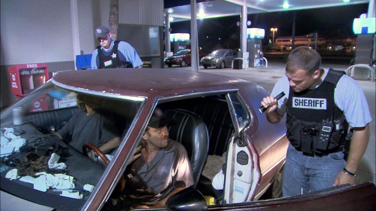This TV publicity image released by Fox shows police officers in Hillsborough, Fla., interrogating two occupants of a car for suspicious drug activity in the 