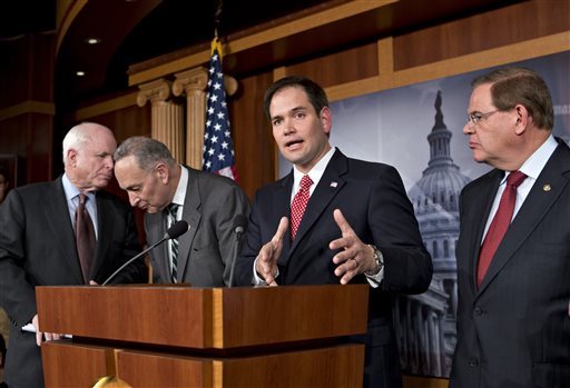 Sen. Marco Rubio, R-Fla., center, speaks at a Capitol Hill news conference on immigration legislation with a members of a bipartisan group of leading senators, including, from left, Sen. John McCain, R-Ariz., Sen. Chuck Schumer, D-N.Y. and Sen. Robert Menendez, D-N.J. Republican members of the Gang of Eight know theyâll have a tough time selling comprehensive immigration reform to a significant number of conservatives. (Photo: J. Scott Applewhite/AP file)