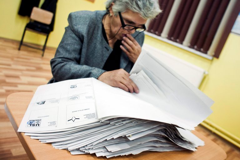   An electoral worker counts ballots in Corbu, eastern Romania, Sunday, Dec.9, 2012. Romaniaâs center-left government won a clear victory in Sundayâs parliamentary elections according to exit polls, but the result could inflame the personal rivalry between the nationâs top two officials and bring yet more political upheaval. (AP Photo/Bogdan Chesaru)  