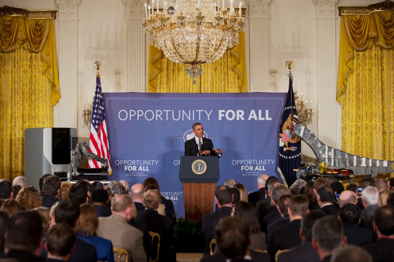 President Barack Obama speaks about manufacturing innovation institutes, Tuesday, Feb. 25, 2014, in the East Room of the White House in Washington. Obama announced new Pentagon and private-sector partnerships aimed at beefing up advanced manufacturing technology in the US to be based initially in Chicago and Detroit. The partnerships are funded with $140 million from the Pentagon and matched by area university and business consortiums. (AP Photo/Jacquelyn Martin)