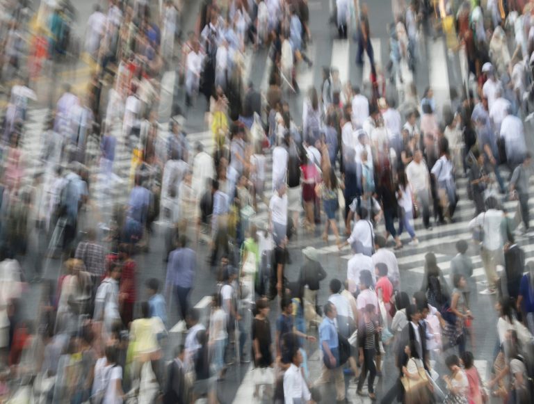 People walk a street at Shibuya shopping district in Tokyo, Friday, Aug. 29, 2014. Japan's vital signs remained weak in July as wages fell further and household spending dropped, signaling continued weakness in the world's third-largest economy. Data released Friday showed the inflation rate was unchanged from the previous month. The core price consumer index that excludes volatile fresh food prices rose 3.3 percent in July, the same as a month earlier. (AP Photo/Koji Sasahara)
