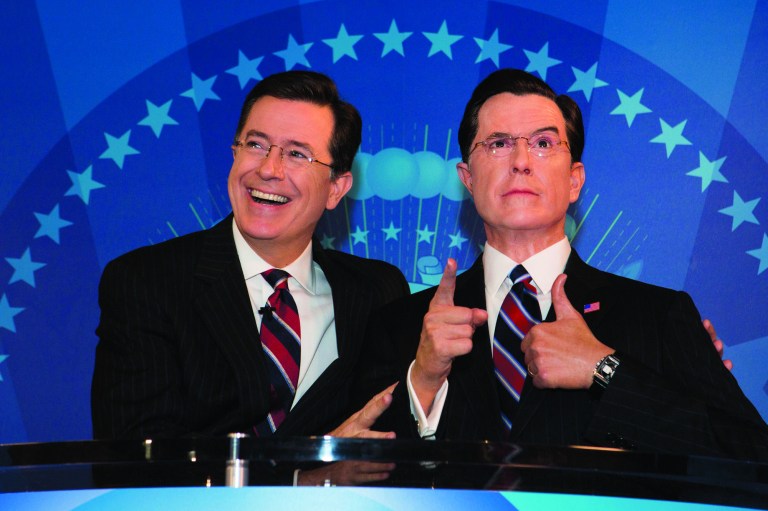 Comedian and television host, Steven Colbert, poses with a wax figure of himself, which was unveiled at the Madame Tussauds wax museum on Friday. (Graeme Jennings/Examiner)