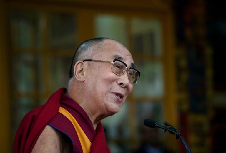 Tibetan spiritual leader the Dalai Lama speaks to a crowd during an event marking 25 years since the leader was awarded the Nobel Peace Prize, in Dharmsala, India, Thursday, Oct. 2, 2014. (AP Photo/Ashwini Bhatia)