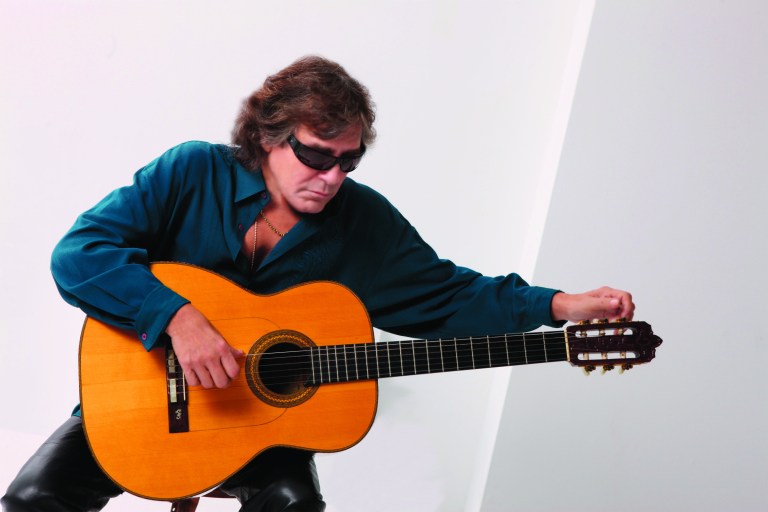 Jose Feliciano lights a yuletide fire at the Howard Theatre