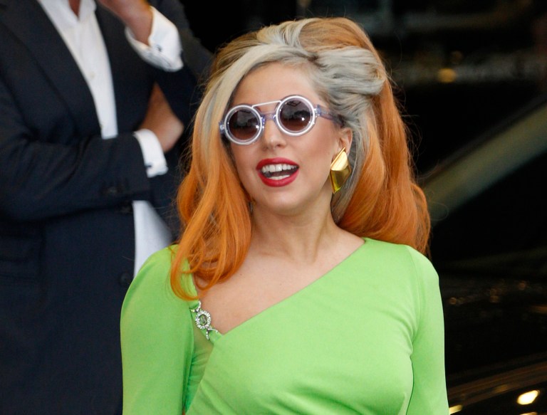   FILE - In this May 16, 2012, file photo, Lady Gaga arrives at the Sungshan airport in Taipei, Taiwan. Lady Gaga has been struck on the head by a pole while performing during the third of three shows in Auckland, Sunday, June 10, 2012. (AP Photo/Wally Santana, File)  