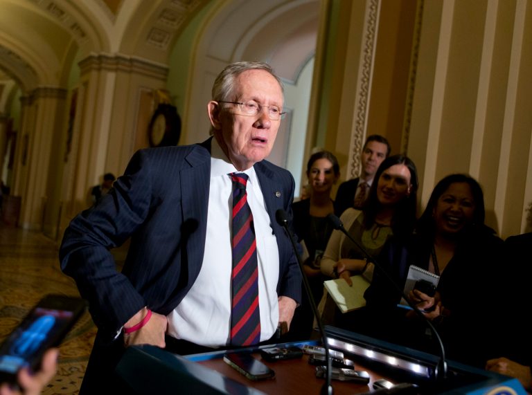 Senate Majority Leader Harry Reid, D-Nev., required Senators to vote at their desks on the Senate floor, a move he has reserved for the most consequential legislation.  (AP Photo/J. Scott Applewhite)