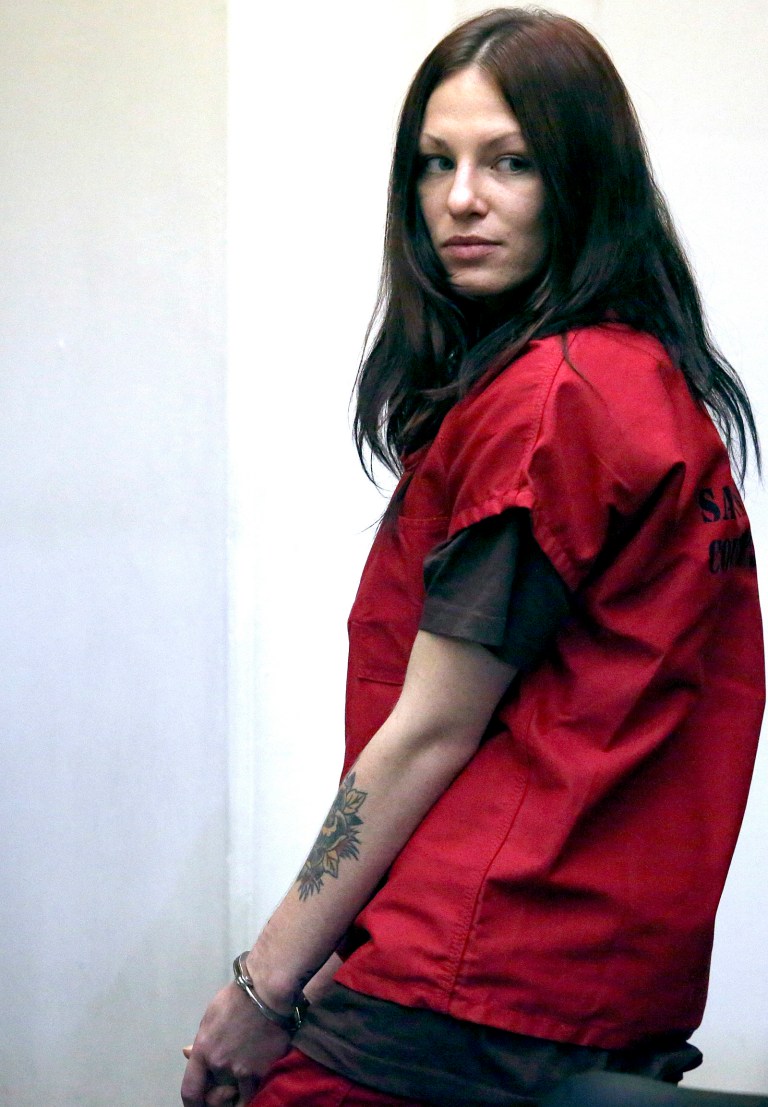 Alix Tichelman looks back toward her family after her arraignment in Santa Cruz County Superior Court on Wednesday, July 16, 2014, in Santa Cruz, Calif. Tichelman, faces manslaughter charges in the death last November of Forrest Hayes, a Google executive after she walked away from him when he overdosed on heroin on his yacht. (AP Photo/Santa Cruz Sentinel, Shmuel Thaler, Pool)