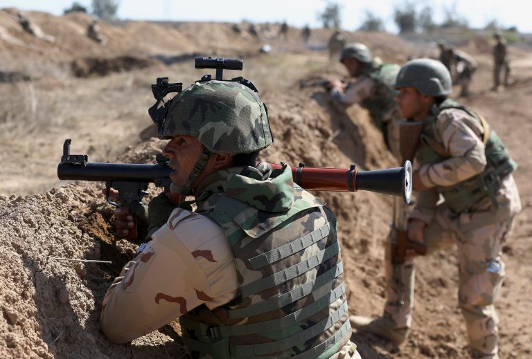 Iraqi security forces participate in a drill as U.S. forces train them in Taji, north of Baghdad, Iraq, Saturday, March 21, 2015. (AP Photo/Karim Kadim)