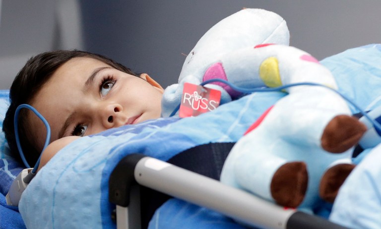5-year-old Ashya King arrives for first proton beam treatment of his brain tumor at Proton Therapy Center in Prague, Czech Republic, Monday, Sept. 15, 2014. Ashya's parents believe the treatment available at the Proton Therapy Center in Prague would be better for their son than the conventional radiotherapy offered in Britain. (AP Photo/Petr David Josek)