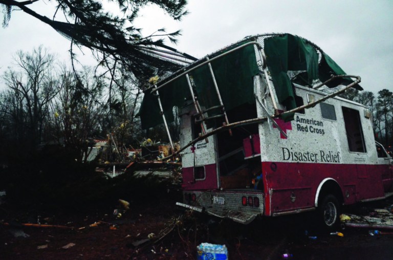 A trampoline rests on top of a damaged American Red Cross disaster relief truck outside of the Hattiesburg American Red Cross center which was completely destroyed by an apparent tornado that moved through Hattiesburg, Miss., Sunday, Feb. 10, 2013. (AP Photo/The Hattiesburg American, Bryant Hawkins)