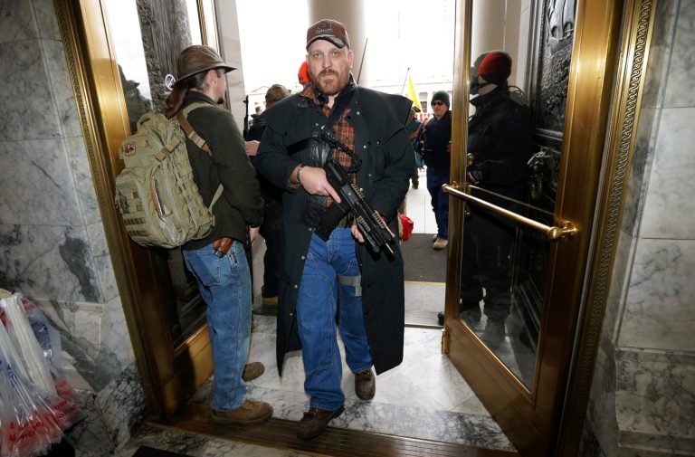 Surge of gun sales may be in reaction to recent gun control rhetoric from Democrats. (AP Photo/Ted S. Warren)