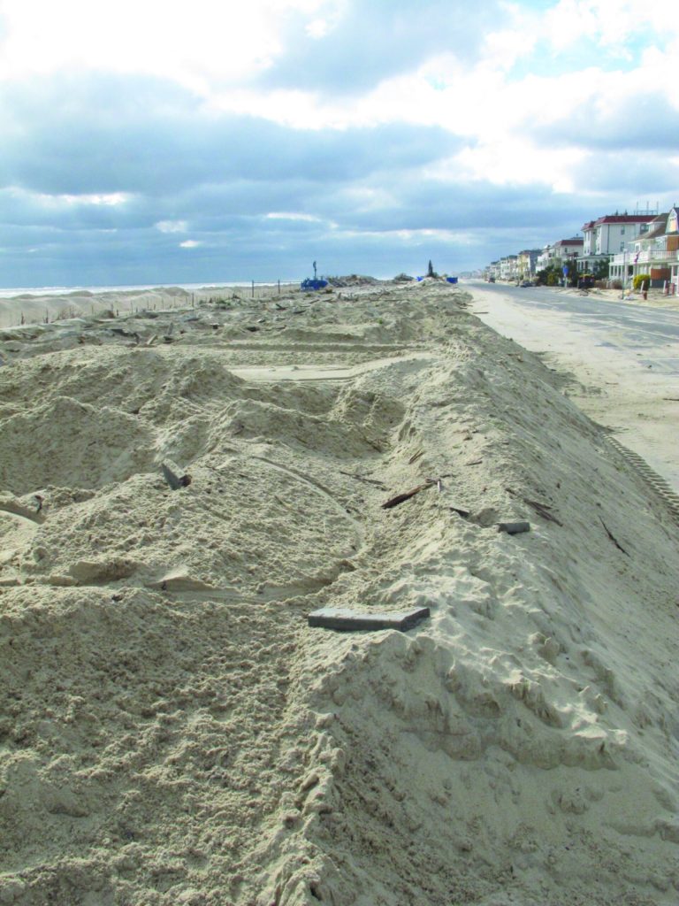 Piles of sand are all that remain where the Belmar N.J. boardwalk used to stand, in a Nov. 15, 2012 photo. Superstorm Sandy took a bite out of the Jersey shore, washing away millions of tons of sand and slimming down beaches along the state's 127-mile coastline. (AP Photo/Wayne Parry)