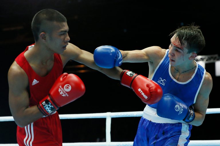 Michael Conlan of Northern Ireland, left, fights Matthew Martin from Nauru during their men's bantam weight (56kg) boxing bout at the Commonwealth Games Glasgow 2014, in Glasgow, Scotland, Friday, July, 25, 2014. (AP Photo/Alastair Grant)