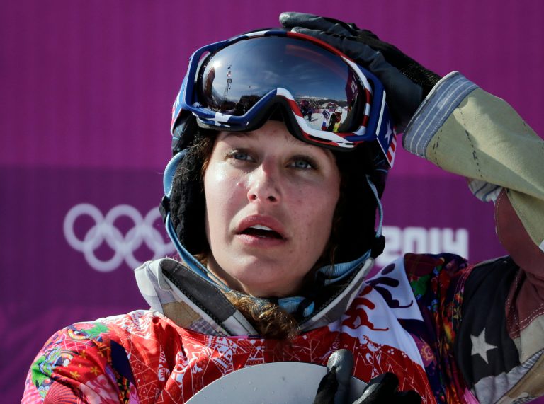 Lindsey Jacobellis  of the United States reacts after winning the small final of the women's snowboard cross at the Rosa Khutor Extreme Park, at the 2014 Winter Olympics, Sunday, Feb. 16, 2014, in Krasnaya Polyana, Russia. (AP Photo/Andy Wong)