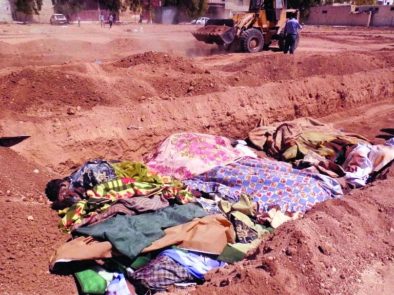 This citizen journalism image provided by Shaam News Network SNN, taken on Sunday, Aug. 26, 2012, purports to show people killed by shabiha, pro-government militiamen, being buried in a mass grave in Daraya, Syria. According to activists' accounts, government forces retook the Damascus suburb of Daraya from rebel control three days ago and have since gone on a killing spree. Reports of the death toll range widely from more than 300 to as many as 600. (AP Photo/Shaam News Network, SNN) THE ASSOCIATED PRESS IS UNABLE TO INDEPENDENTLY VERIFY THE AUTHENTICITY, CONTENT, LOCATION OR DATE OF THIS CITIZEN JOURNALIST IMAGE