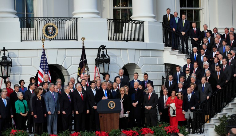 President Trump joined by Vice President Mike Pence, House Speaker Paul Ryan of Wis., Senate Majority Leader Mitch McConnell of Ky., and other Republican lawmakers speaks during a passage of the tax bill event at the White House. (AP Photo/Manuel Balce Ceneta)