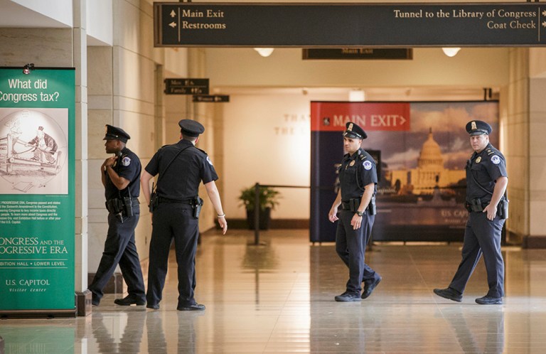 Capitol Police officers secure the Capitol Visitor's Center on Capitol Hill in Washington, Monday, March 28, 2016, which was closed to tourists following a shooting. (AP Photo/J. Scott Applewhite)