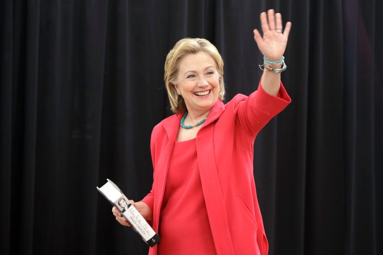 Former Secretary of State Hillary Clinton waves as she arrives at a Little Rock, Ark., Wal-Mart store for a book signing event Friday, June 27, 2014. (AP Photo/Danny Johnston)