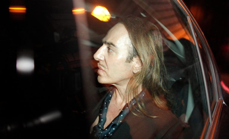 FILE - in this June 22, 2011 file photo, former Dior designer John Galliano leaves the Paris court house, charged with hurling anti-Semitic slurs in a Paris cafe. Galliano will be designing fashion again, joining Paris house Martin Margiela, three years after leaving the business in disgrace. Maison Martin Margiela's parent company OTB announced in a statement Monday, Oct.6, 2014 that they're bringing Galliano on board as creative director, praising his 