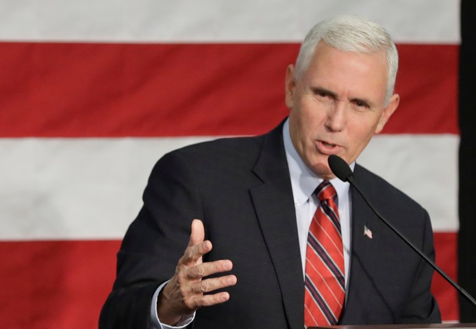 "We'll be looking at the facts and the information," Pence told reporters. "Given some of the intelligence failures in recent years, the president-elect made it clear he is skeptical of the conclusions." (AP Photo/Darron Cummings)