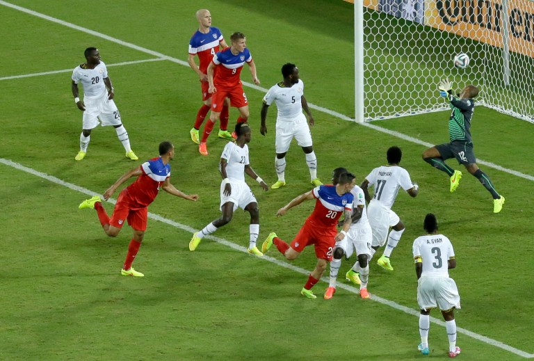 United States' John Brooks, second from left, scores his side's second goal during the group G World Cup soccer match between Ghana and the United States at the Arena das Dunas in Natal, Brazil, Monday, June 16, 2014. The United States defeated Ghana 2-1.(AP Photo/Hassan Ammar)