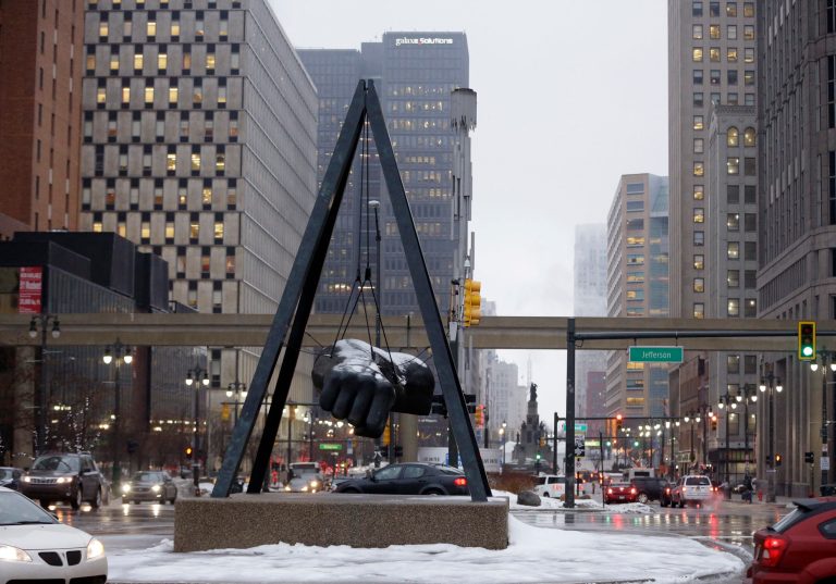 In a photo from Thursday, Feb. 20, 2014 is the monument to the boxer Joe Louis in Detroit. Detroit's emergency manager filed a plan Friday, Feb. 21, 2014 to restructure the city's $18 billion debt by making cuts to pensions and creditors while offering a blueprint for emerging from the largest municipal bankruptcy in U.S. history. (AP Photo/Carlos Osorio)