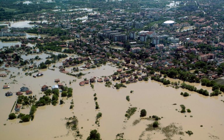 A flooded area is seen in Obrenovac, some 30 kilometers (18 miles) southwest of Belgrade, Serbia, Monday, May 19, 2014. Belgrade braced for a river surge Monday that threatened to inundate Serbia's main power plant and cause major power cuts in the crisis-stricken country as the Balkans struggle with the consequences of the worst flooding in southeastern Europe in more than a century. At least 35 people have died in Serbia and Bosnia in the five days of flooding caused by unprecedented torrential rain, laying waste to entire towns and villages and sending tens of thousands of people out of their homes, authorities said. (AP Photo)