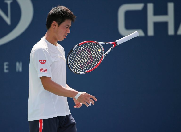 Kei Nishikori, of Japan, flips his racket in the air during a practice session in preparation for Monday's final match against Marin Cilic, of Croatia, the 2014 U.S. Open tennis tournament, Sunday, Sept. 7, 2014, in New York. (AP Photo/Mike Groll)